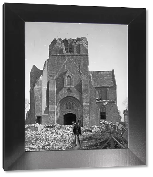 Belgian soldiers seen here inspecting the remains of a church on the battlefield close to
