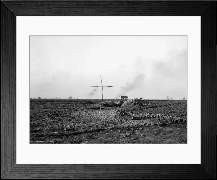 Framed Print : A simple cross marks the spot of a grave of a Belgian soldier killed during the fighting