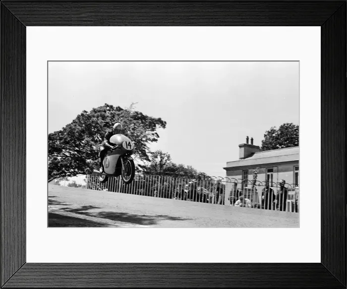 Framed Print : Isle of Man TT Races - Junior International. Mike Hailwood goes over Ballaugh