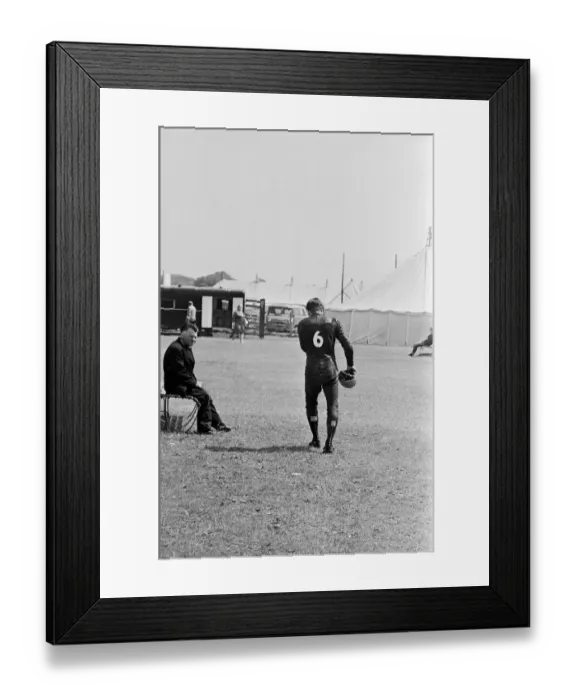 Framed Print : Isle of Man TT Races -Junior 125cc Event. Bill Ivy walks away after his Yamaha only