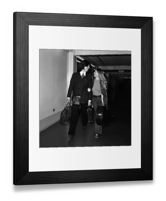 Framed Print : Singer Mary Hopkin and her record producer husband Tony Visconti seen here leaving