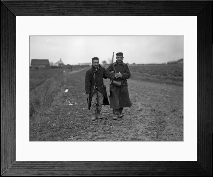 Framed Print : Wounded Belgian soldier helping another from the firing line during the Battle of Framed Print : Wounded Belgian soldier helping another from the firing line during the Battle of