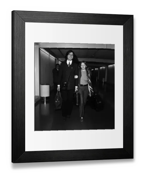 Framed Print : Singer Mary Hopkin and her record producer husband Tony Visconti seen here leaving