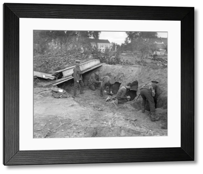 Framed Print : Marines from the Naval brigade digging holes into the side of the trench in which they Framed Print : Marines from the Naval brigade digging holes into the side of the trench in which they