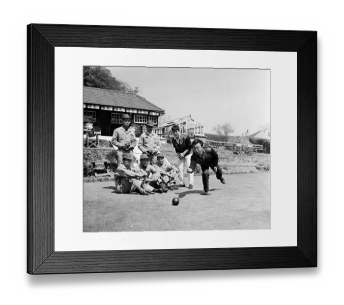 Framed Print : Japanese rider Shimazaki playing bowls with his team of mechanics watching Framed Print : Japanese rider Shimazaki playing bowls with his team of mechanics watching