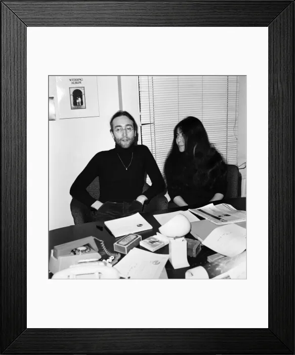 Framed Print : Beatles singer John Lennon with wife Yoko Ono at Apple headquarters as he sends his MBE