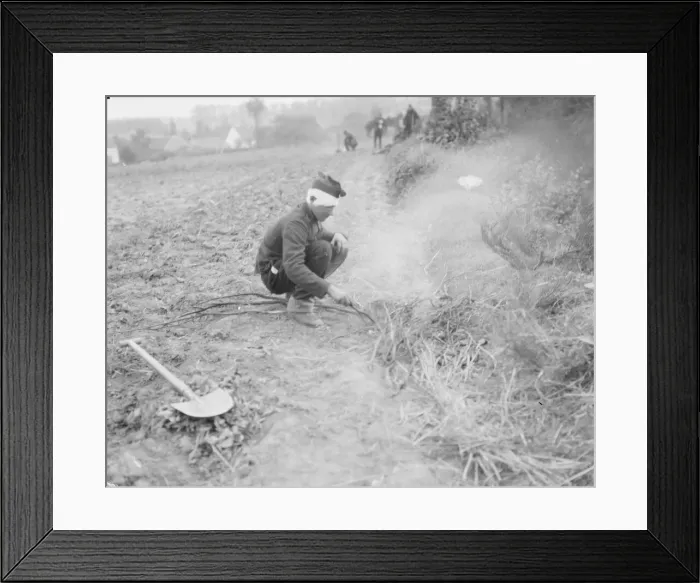 Framed Print : A wounded Belgian soldier lights a fire in a field close to the town of Haelen Framed Print : A wounded Belgian soldier lights a fire in a field close to the town of Haelen