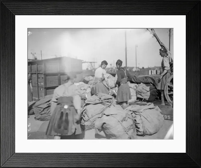 Framed Print : London Scottish Territorials seen here unloading a supply train at Orleans, France Framed Print : London Scottish Territorials seen here unloading a supply train at Orleans, France