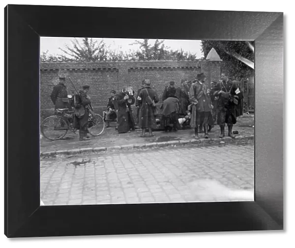 Battle of Hofstade. Priests attended to an injured soldier as a cycle patrol set out