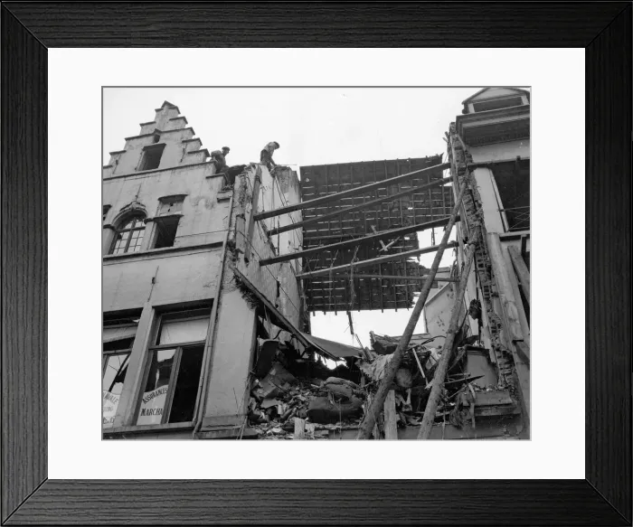 Framed Print : Locals inspect the latest bomb damage in Antwerp the result of one of the three air Framed Print : Locals inspect the latest bomb damage in Antwerp the result of one of the three air