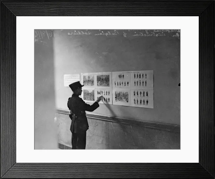 Framed Print : Diagrams of English, French and Belgian uniforms pinned to the wall for instruction of Framed Print : Diagrams of English, French and Belgian uniforms pinned to the wall for instruction of