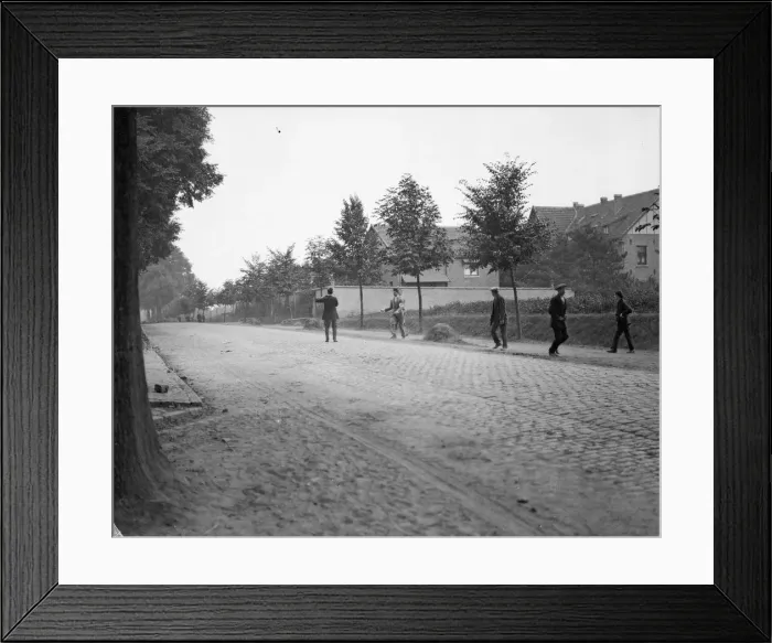 Framed Print : A red cross worker urgers cinematographer Warren Yates to take cover as he comes under Framed Print : A red cross worker urgers cinematographer Warren Yates to take cover as he comes under