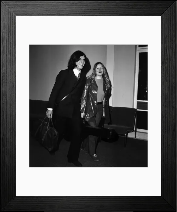 Framed Print : Singer Mary Hopkin and her record producer husband Tony Visconti seen here leaving
