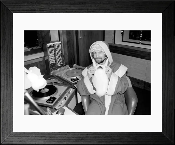Framed Print : Radio One Disc Jockey Noel Edmonds dressed as Father Christmas on his breakfast show