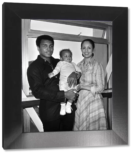 Mohammad Ali pictured with his wife Veronica and baby Hanna at Heathrow Airport today