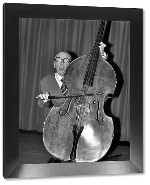 Entertainment. Music. Arthur A. Askey playing the cello. February 1981 81-00677