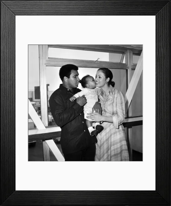 Framed Print : Mohammad Ali pictured with his wife Veronica and baby Hanna at Heathrow Airport today Framed Print : Mohammad Ali pictured with his wife Veronica and baby Hanna at Heathrow Airport today