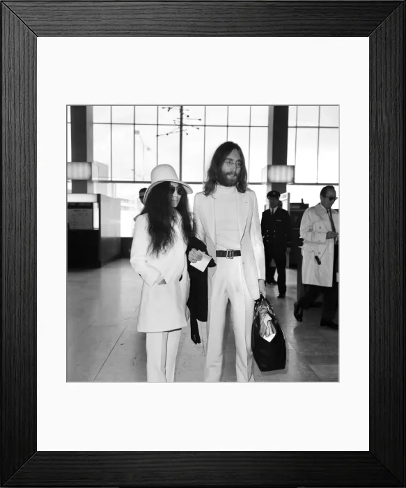 Framed Print : Beatles singer songwriter John Lennon and wife Yoko Ono pictured at Heathrow today