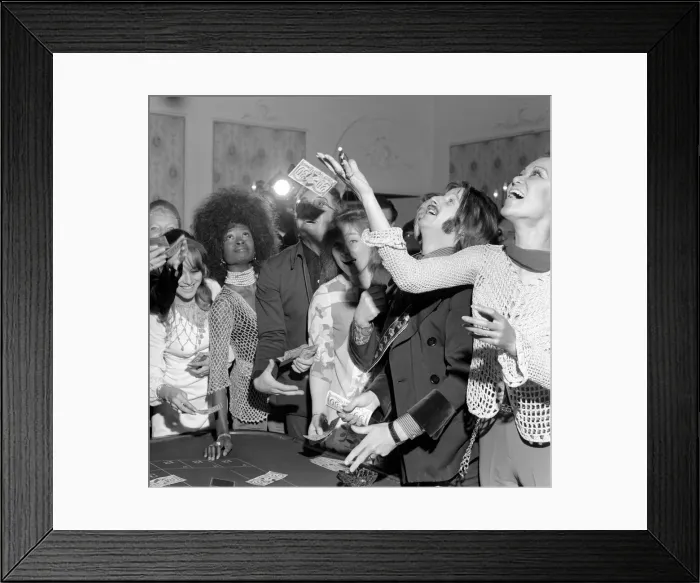 Framed Print : Peter Sellers and Ringo Starr have a go at roulette at the Thank you Press party at Les