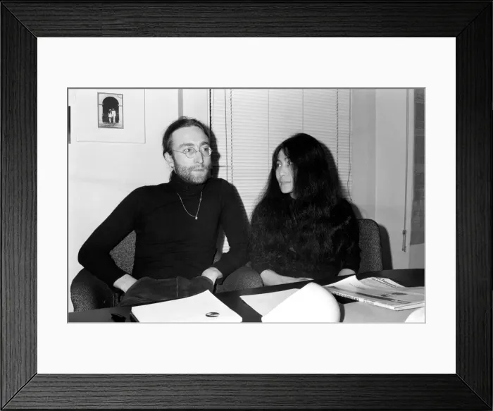 Framed Print : Beatles singer John Lennon with wife Yoko Ono at Apple headquarters as he sends his MBE
