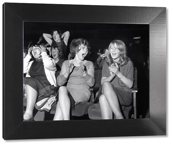 Screaming girl fans greet the Beatles on their appearance at the ABC Cinema in Edinburgh