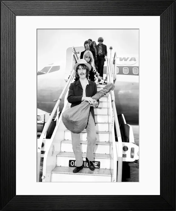 Framed Print : Beatles guitarist George Harrison complete with sitar at Heathrow Framed Print : Beatles guitarist George Harrison complete with sitar at Heathrow