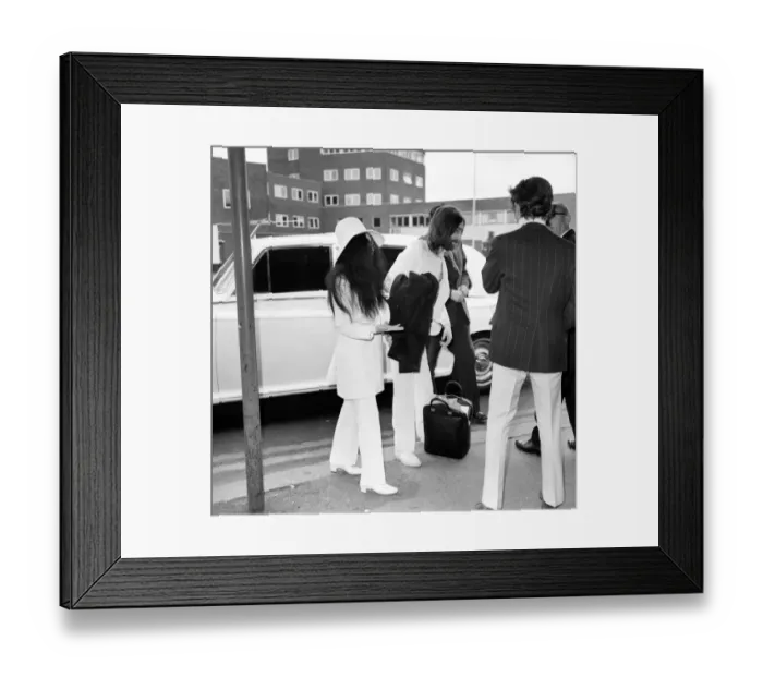 Framed Print : Beatles singer songwriter John Lennon and wife Yoko Ono pictured at Heathrow today Framed Print : Beatles singer songwriter John Lennon and wife Yoko Ono pictured at Heathrow today
