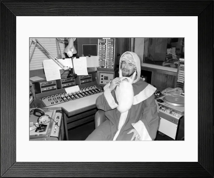 Framed Print : Radio One Disc Jockey Noel Edmonds dressed as Father Christmas on his breakfast show Framed Print : Radio One Disc Jockey Noel Edmonds dressed as Father Christmas on his breakfast show