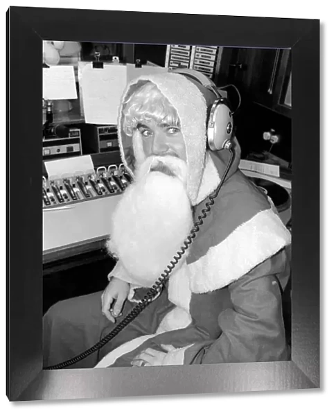 Radio One Disc Jockey Noel Edmonds dressed as Father Christmas on his breakfast show