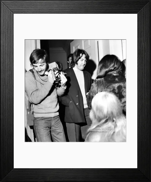 Framed Print : Paul McCartney of the Beatles smiles to console waiting girls outside the Apple