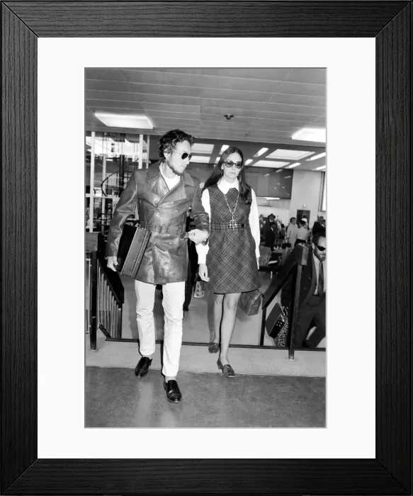 Framed Print : American folk singer, Bob Dylan and his wife left Heathrow Airport today to return home