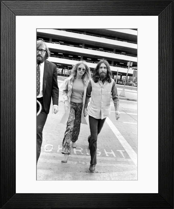 Framed Print : George Harrison of the Beatles with his wife Pattie at Heathrow today after seeing offhis Framed Print : George Harrison of the Beatles with his wife Pattie at Heathrow today after seeing offhis