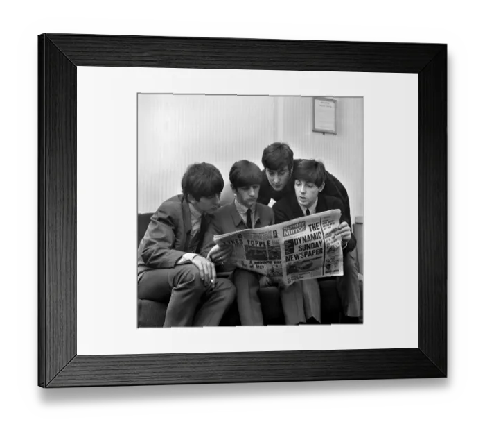 Framed Print : Beatles pop grouo reading the Sunday Mirror newspaper. Left to right Framed Print : Beatles pop grouo reading the Sunday Mirror newspaper. Left to right