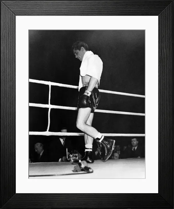 Framed Print : British boxer Walter Cartier looking dejected as he walks from the ring after creating a Framed Print : British boxer Walter Cartier looking dejected as he walks from the ring after creating a