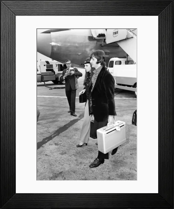 Framed Print : Beatles drummer Ringo Starr with wife Maureen at Heathrow today