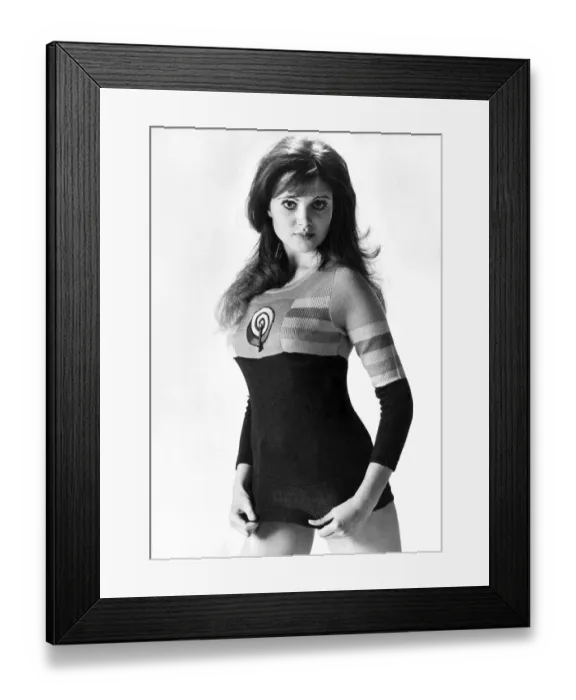 Framed Print : Actress Madeline Smith wears a sweater with an inset from the Allen Jones painting Framed Print : Actress Madeline Smith wears a sweater with an inset from the Allen Jones painting