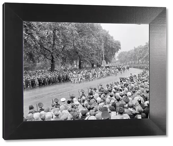 The Coronation of Queen Elizabeth II. Crowds of people watch as the procession