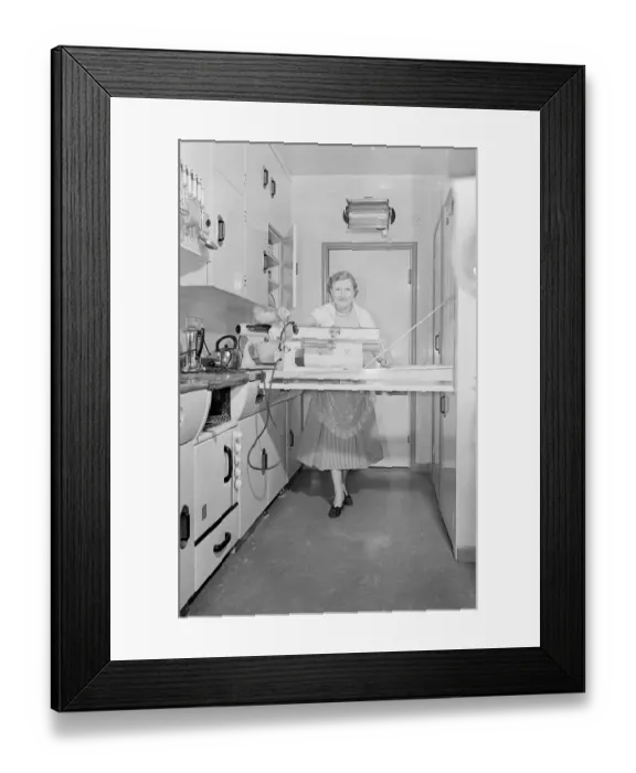 Framed Print : Mrs Susan Davies seen here using her rotary iron in a kitchen full of labour saving Framed Print : Mrs Susan Davies seen here using her rotary iron in a kitchen full of labour saving
