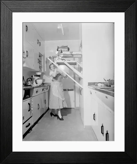 Framed Print : Mrs Susan Davies seen here putting away here rotary iron in a kitchen full of labour Framed Print : Mrs Susan Davies seen here putting away here rotary iron in a kitchen full of labour
