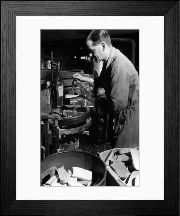 Framed Print : Attaching a wedge heel to a womens shoe. After the strict war regulations banned any Framed Print : Attaching a wedge heel to a womens shoe. After the strict war regulations banned any