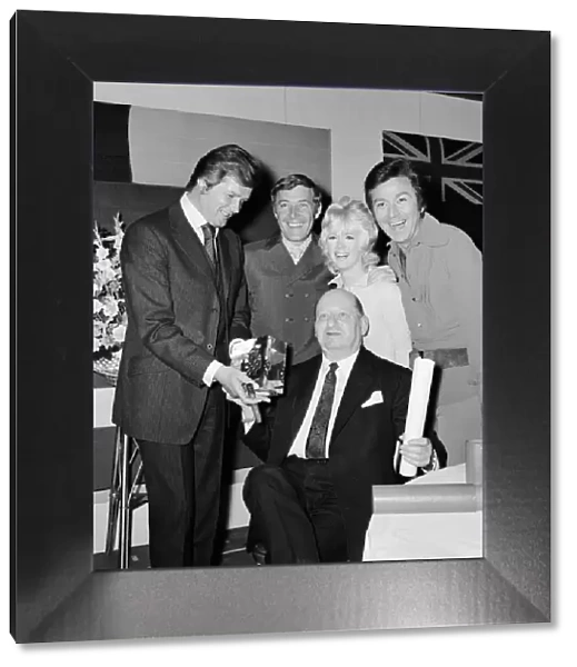 Media Mogul Lew Grade holds the Queens Award for Industry trophy won by ATV
