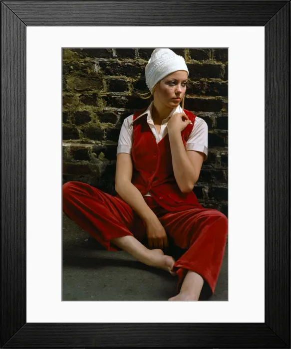 Framed Print : Model wearing a red velvet waistcoat and trousers with white hat, November 1969 Framed Print : Model wearing a red velvet waistcoat and trousers with white hat, November 1969