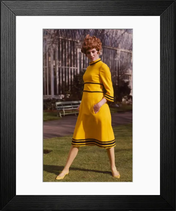 Framed Print : A model wearing a yellow tweed maxi dress designed by Emor, March 1968 Framed Print : A model wearing a yellow tweed maxi dress designed by Emor, March 1968