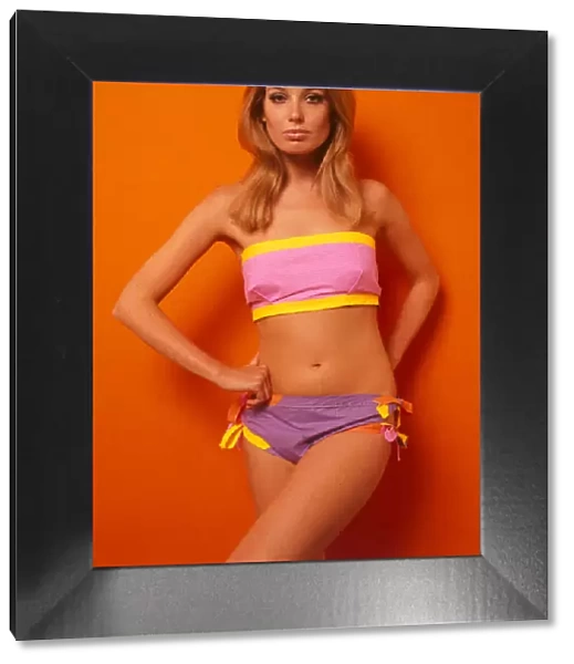 American Paper Fashion Model wearing a stretched beach wrap with matching flipper