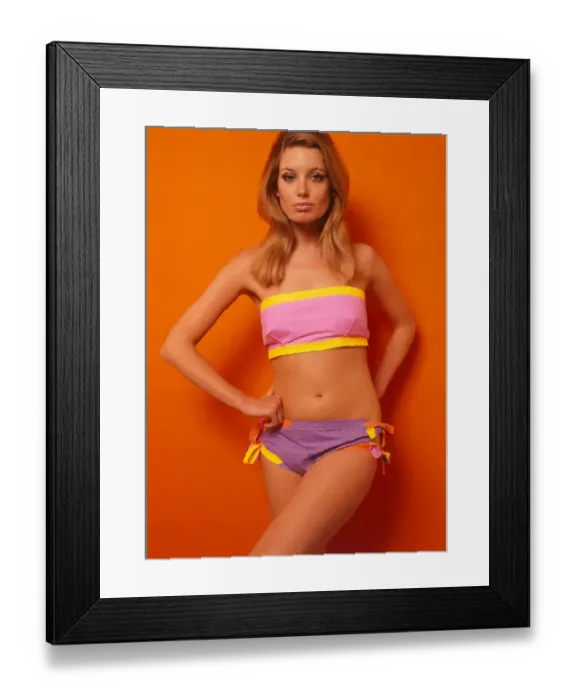 Framed Print : American Paper Fashion Model wearing a stretched beach wrap with matching flipper Framed Print : American Paper Fashion Model wearing a stretched beach wrap with matching flipper