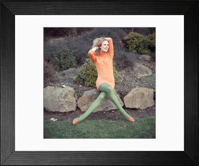 Framed Print : Model wearing full length orange sweater and green matching stockings Framed Print : Model wearing full length orange sweater and green matching stockings
