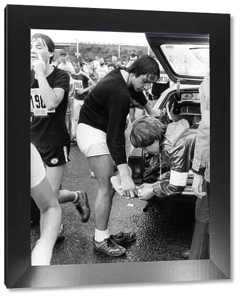 The Great North Run 27 June 1982 - Footsore runner Steve Thompson having his blisters
