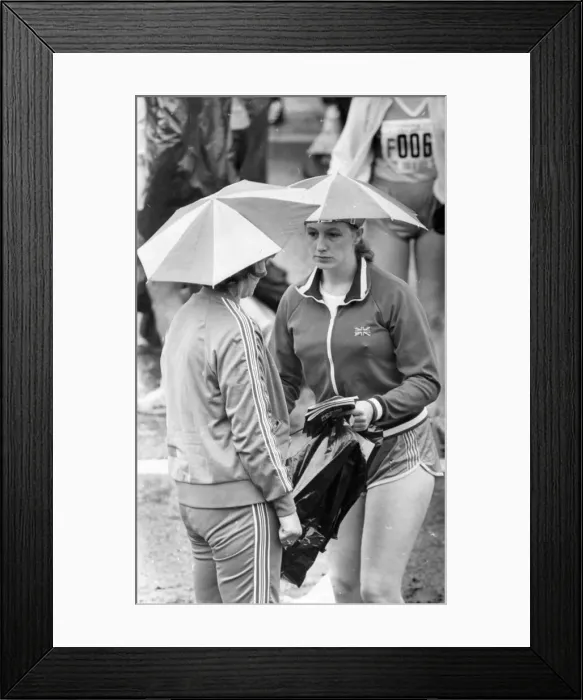 Framed Print : The Great North Run 27 June 1982 - Two runners keep dry before the race Framed Print : The Great North Run 27 June 1982 - Two runners keep dry before the race