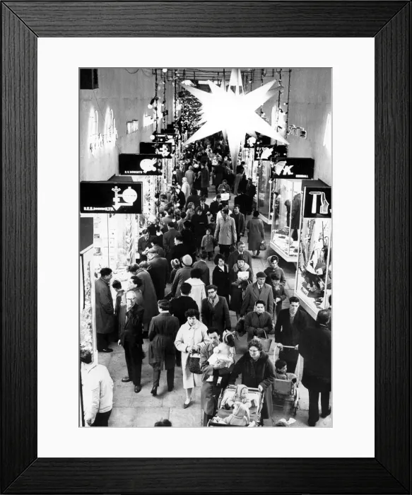 Framed Print : Under the Bethlehem star shoppers stream along the City Arcade in Coventry
