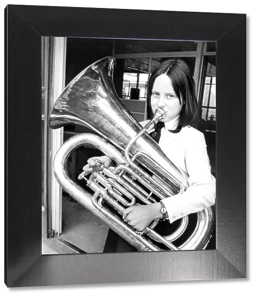 Nine year old Pamela Henderson rehearsing her part with her E-flat Bass Tuba in